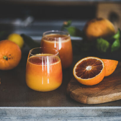 glasses of fresh blood orange juice or smoothie, square crop