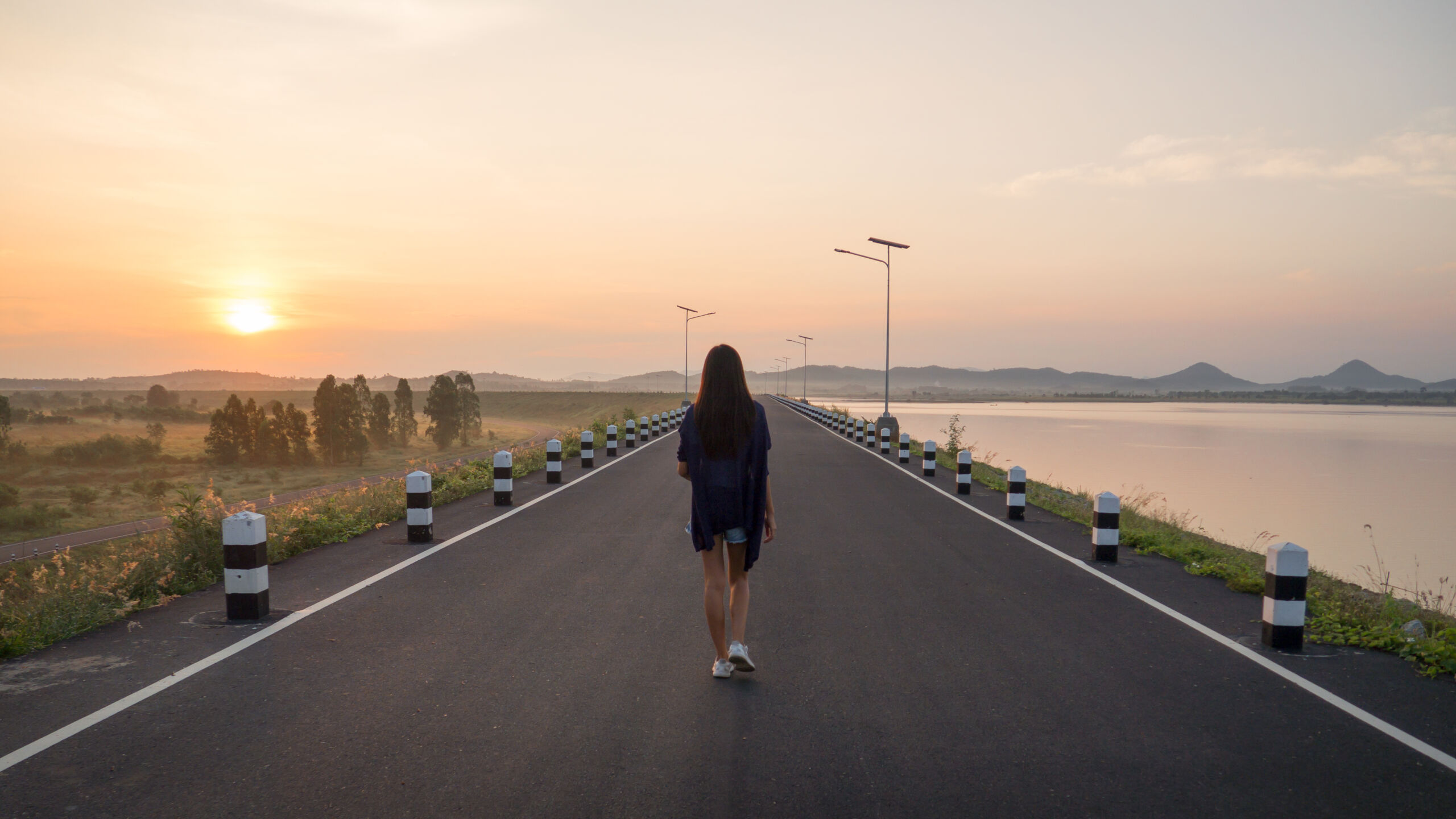 Young Asian Woman Walking On The Road At Sunrise 2026 01 11 10 42 39 Utc Scaled